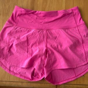 Pink lululemon running shorts